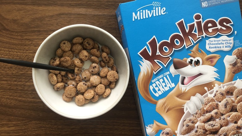 Bowlful of Millville Kookies cereal with milk and spoon.