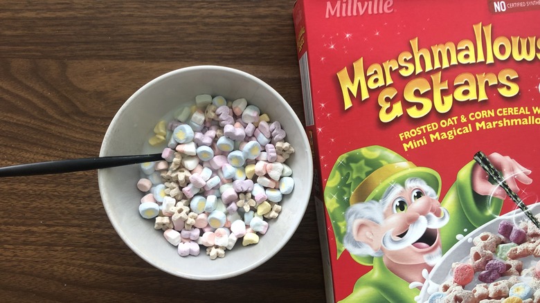 Bowlful of Millville Marshmallows & Stars with milk and spoon.