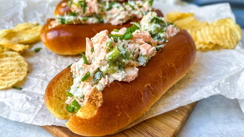 Salmon rolls on parchment paper with potato chips