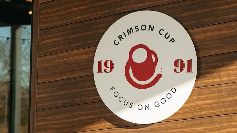 Crimson Cup Coffee sign on wooden wall
