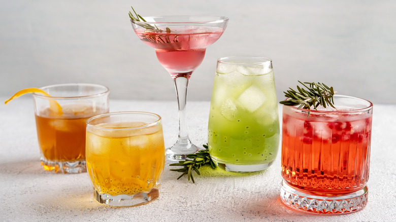 various cocktails on white background