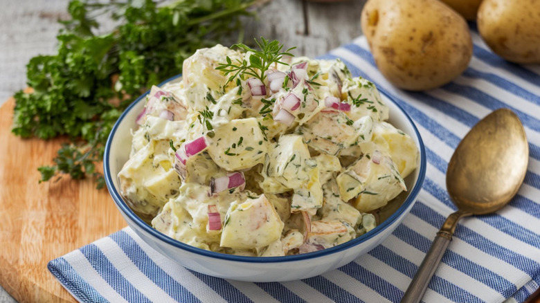 Potato salad with dill and red onion.