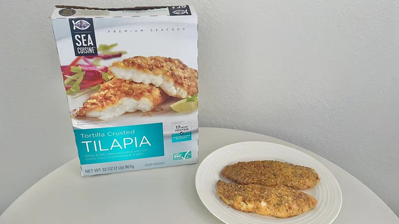 Cooked pieces of Sea Cuisine tortilla crusted tilapia on a plate with a whole box in the back