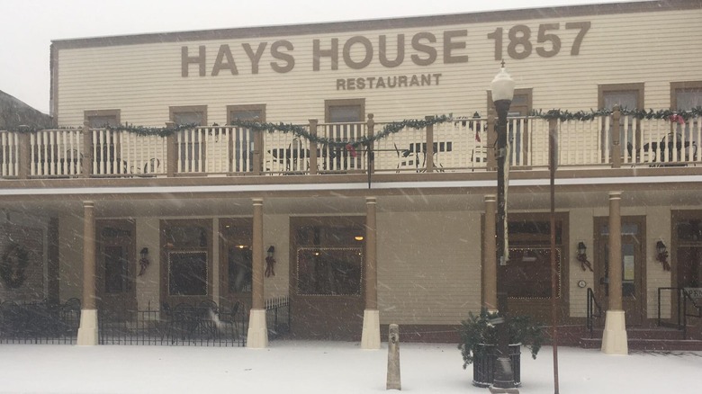 Exterior of the Hays House with sign on a snowy day