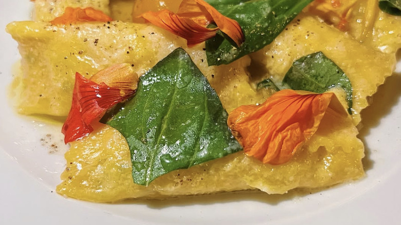 Crevette's Peekytoe crab agnolotti with sungold tomatoes & basil
