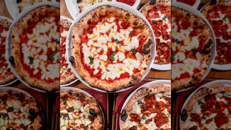 Top view of several woodfired pizzas