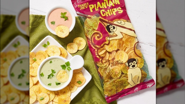 Package of Trader Joe's Plantain Chips with some presented on plate alongside bowls of dip