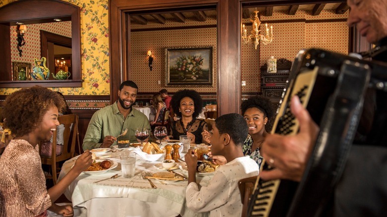 family listening to music and eating at Mama Della's Ristorante