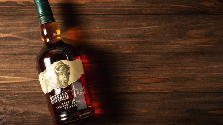 Buffalo Trace Kentucky Straight Bourbon Whiskey laying down on wooden table