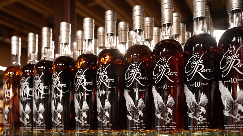 A row of bottled of Eagle Rare 10-year lined up next to each other on a shelf