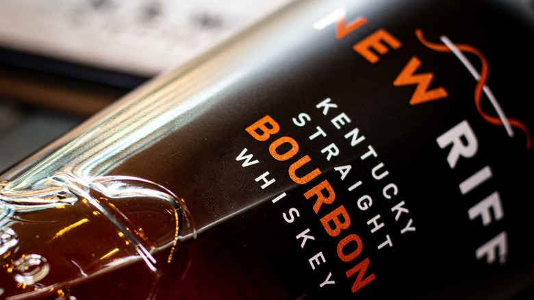 A close up of a bottle of New Riff bourbon showcasing its modern branding