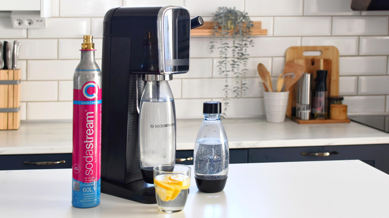 SodaStream machine and accessories on countertop