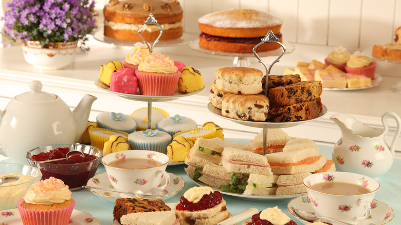 British tea party with cakes tea and sandwiches