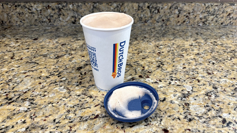 Dutch Bros white chocolate hot cocoa on a marble countertop