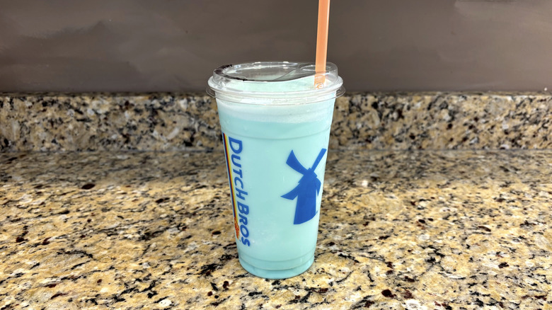 Dutch Bros cotton candy shake on a marble countertop