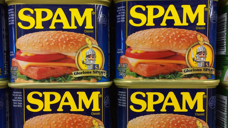 Four cans of SPAM, stacked in sets of two.