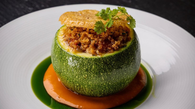 Plated stuffed summer squash with a parmesan tuile