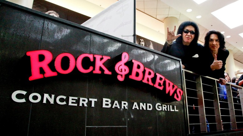 Gene Simmons and Paul Stanley with Rock & Brews sign