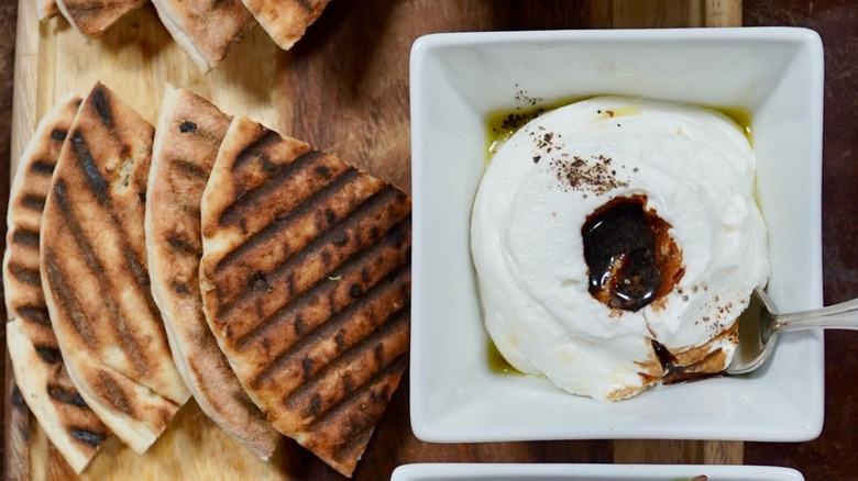 Plated ricotta mezze with pita bread