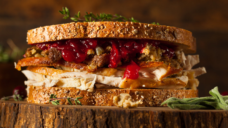 Thanksgiving leftover sandwich against a brown background
