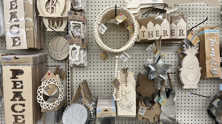 Wooden decorations and signs on shelf