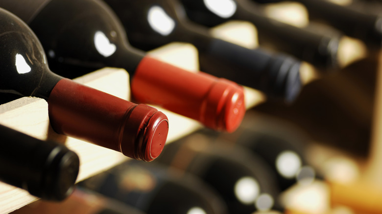 red wine bottles on rack