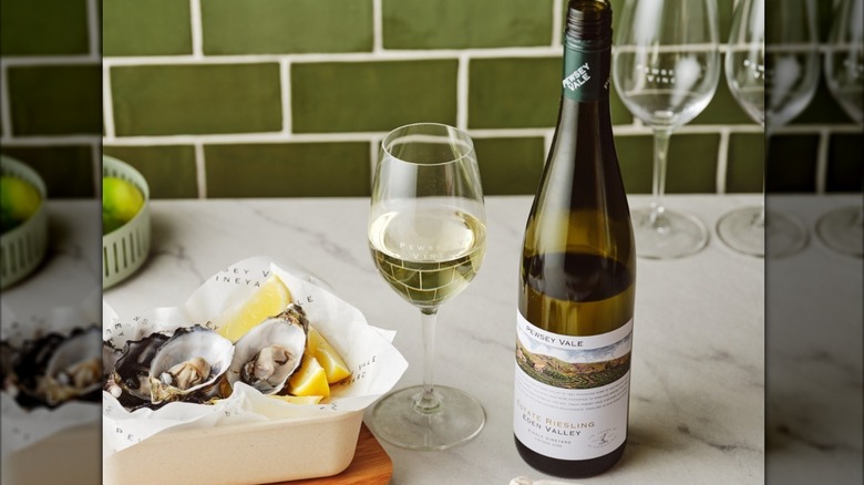 a bottle and glass of Pewsey Vale Estate Riesling white wine with a bowl of oysters