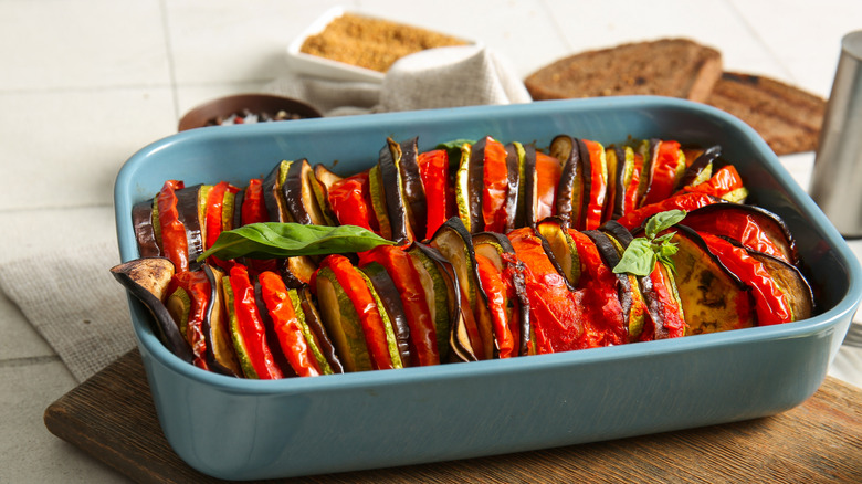 A blue dish with ratatouille