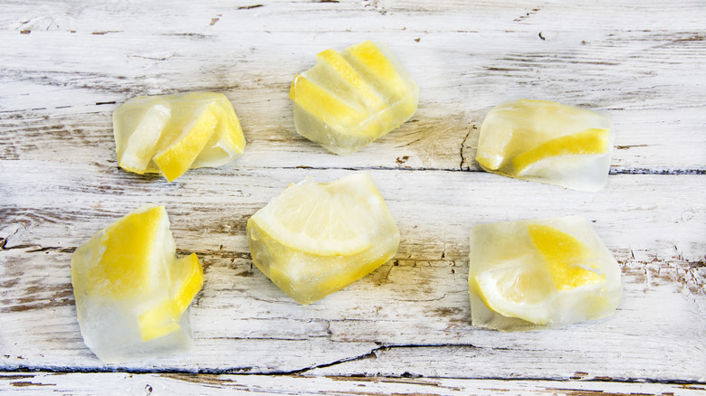 Ice cubes filled with lemon pieces
