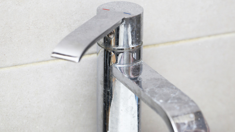 Chrome faucet with limescale spots