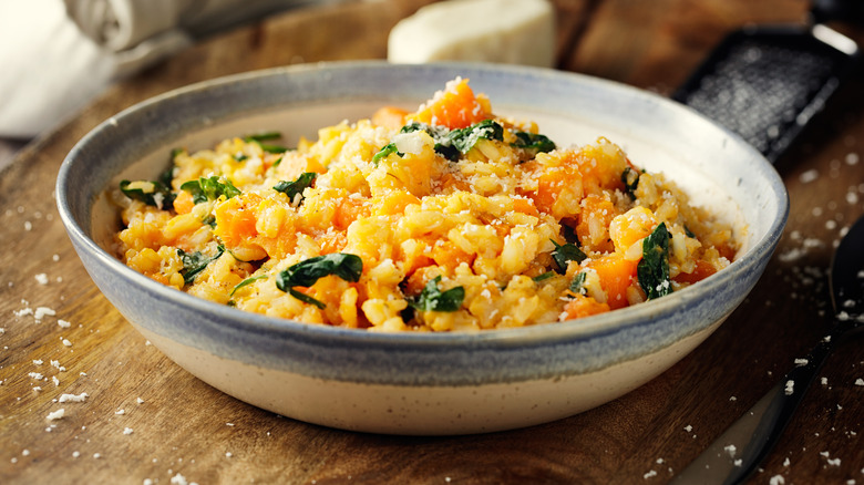 Bowl of risotto with butternut squash and spinach