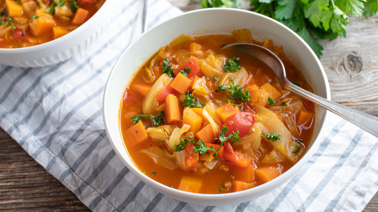 Bowl of vegetable soup with spoon