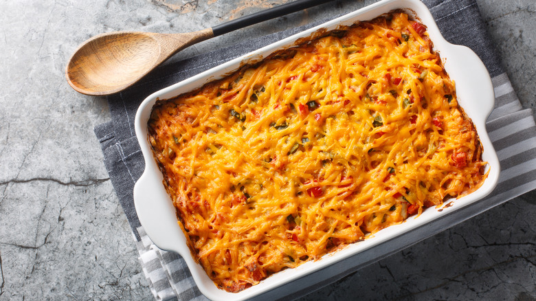 Cheesy casserole in white baking dish