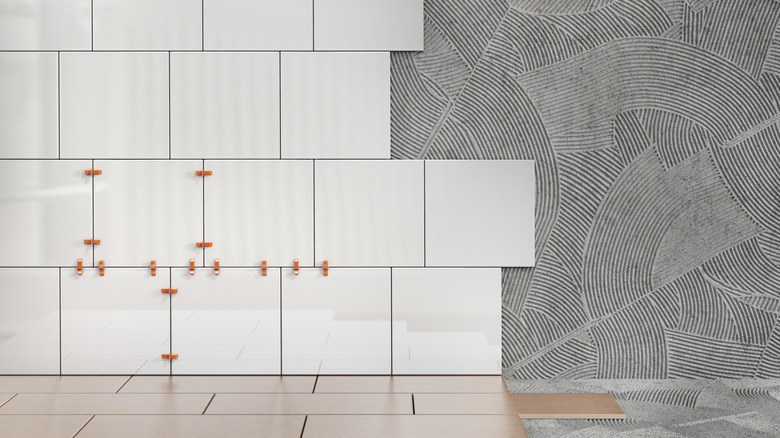 White ceramic tiles installed on half a kitchen wallSev