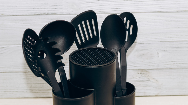 black cooking utensils in organizer