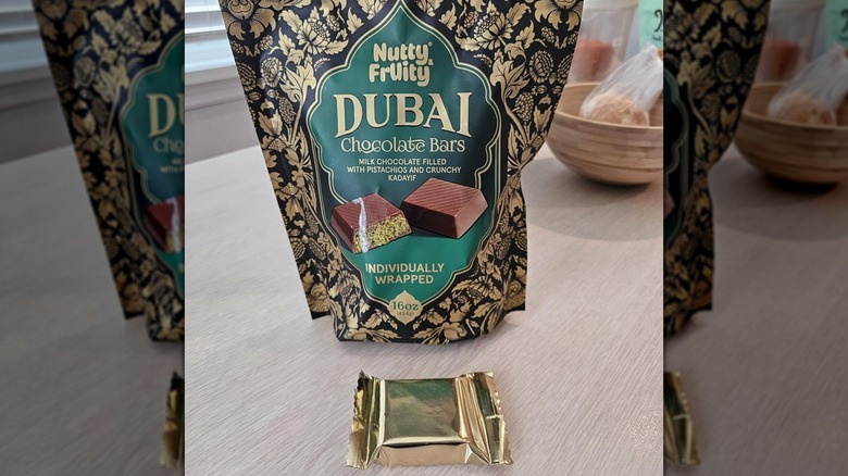 A bag of Nutty & Fruity Dubai Chocolate Bars on a kitchen counter