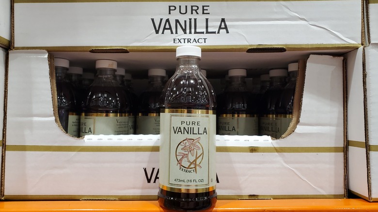 A bottle of Kirkland Signature pure vanilla extract on a shelf at Costco