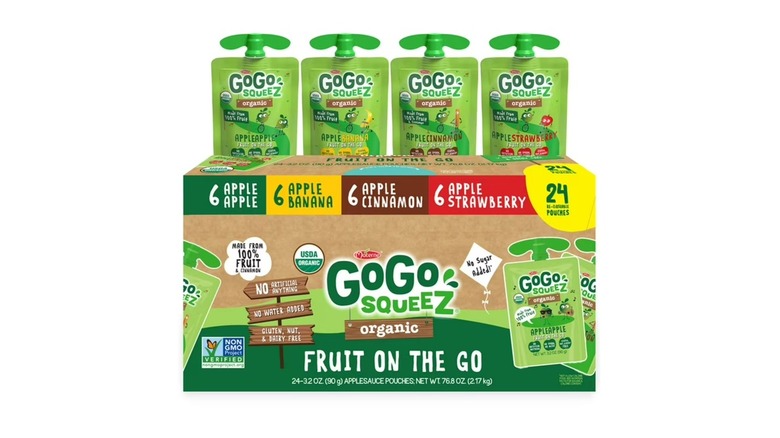 A branded box and four separate pouches of GoGo SqueeZ Organic Applesauce on a white background