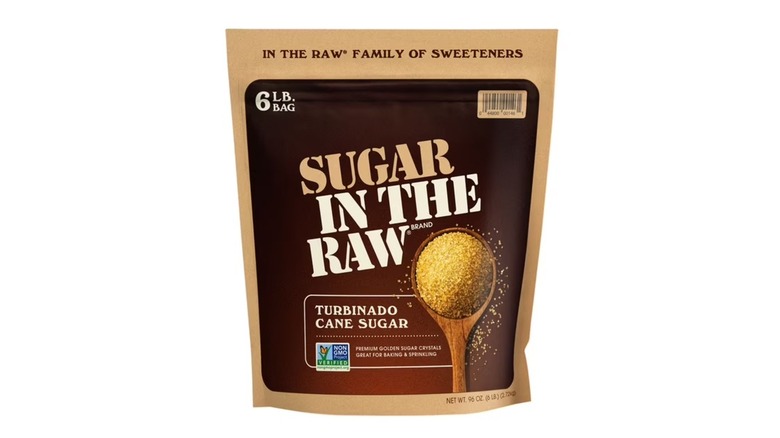 A six-pound bag of Sugar In The Raw turbinado cane sugar on a white background