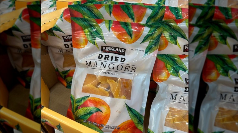 A display of packages of Kirkland Signature Dried Sweetened Mangoes at Costco