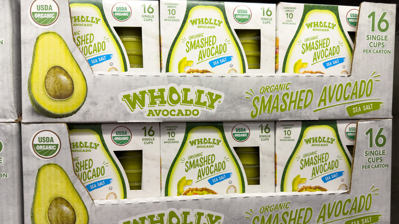 A display of packages of Wholly Organic Smashed Avocado at a Costco warehouse