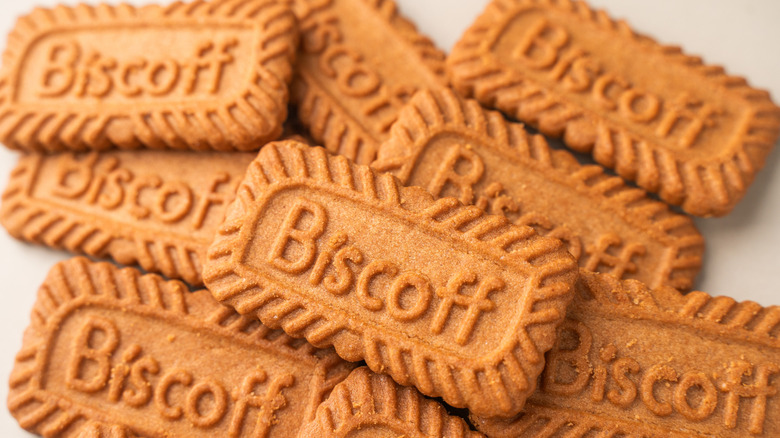 pile of biscoff cookies on a white background