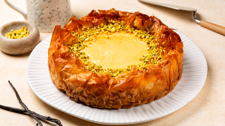whole baklava cheesecake on a plate