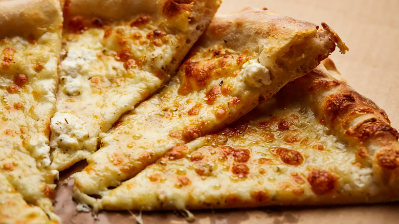 Sliced of white cheese pizza