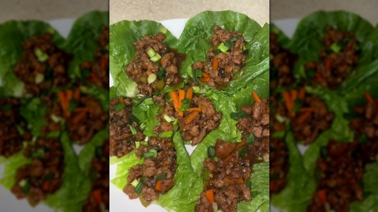 Lettuce wraps filled with cooked crumbled sausage and veggies