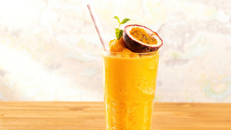 Passion fruit smoothie topped with fresh passion fruit