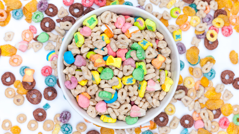 A white bowl overfilled with various cereals