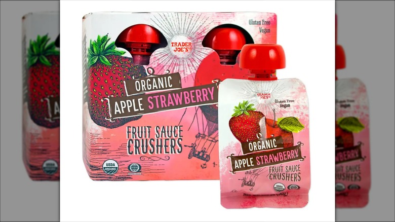 Pink pouch of Trader Joe's Organic Apple Strawberry Fruit Sauce Crushers next to product box