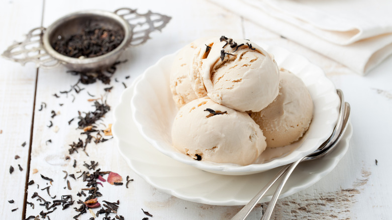 Bowl of Earl Grey ice cream with looseleaf tea in background