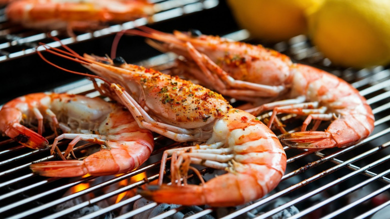 Prawns being cooked on a grill